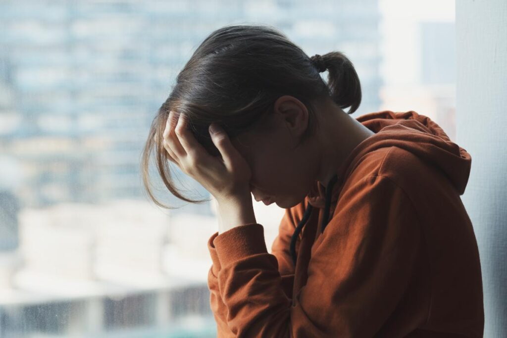 Person feeling the short-term effects of ecstasy abuse